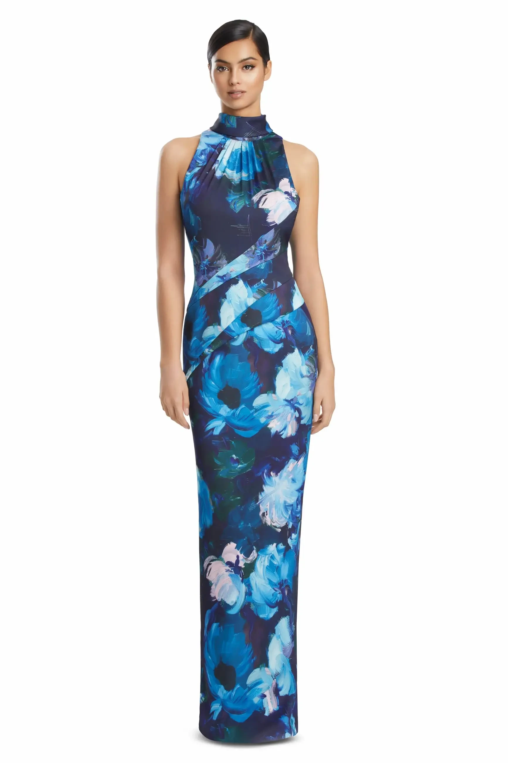 A model wearing a floor-length, sleeveless dress with a floral print in shades of blue and purple.
