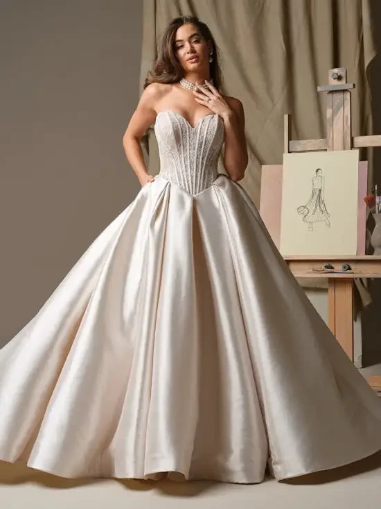 model is wearing a strapless ball gown wedding dress