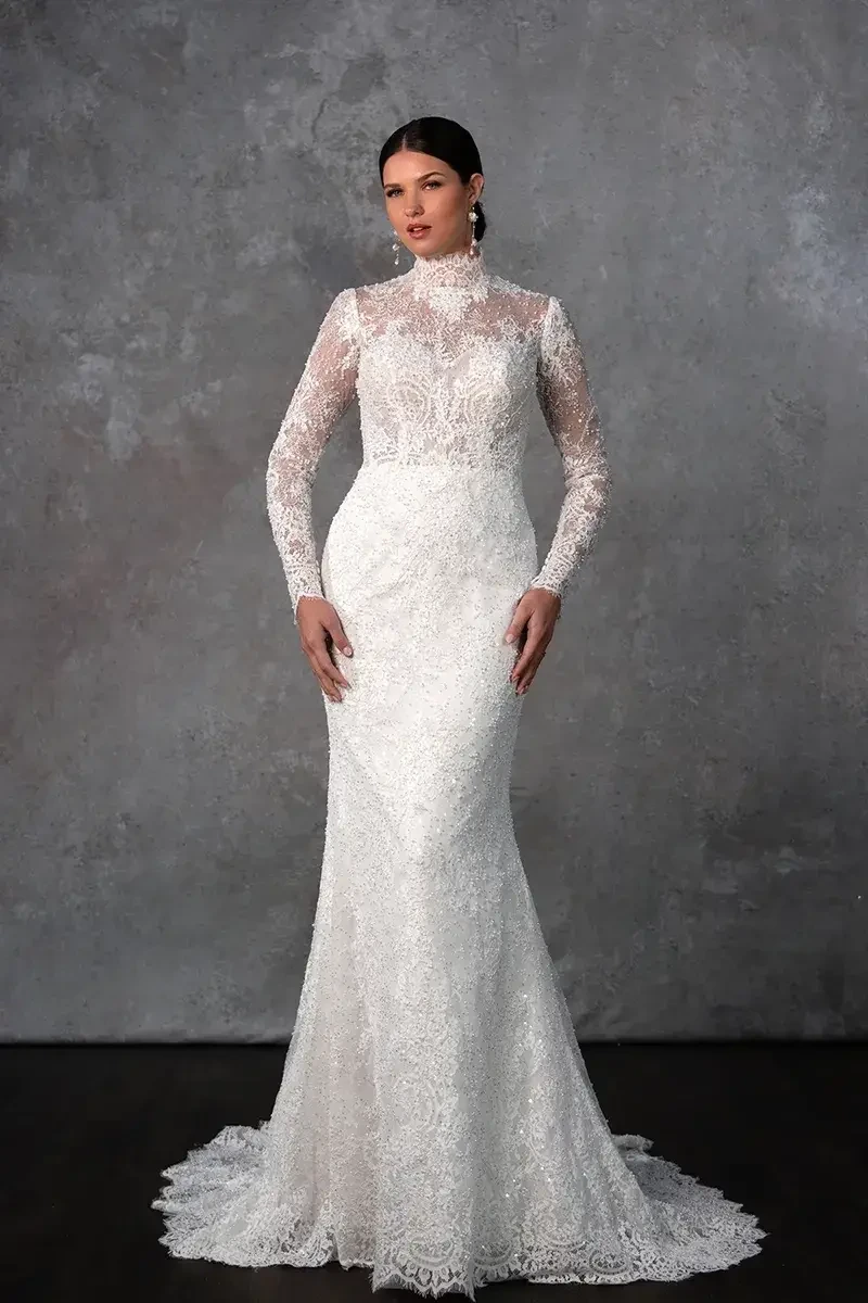 model is wearing a high neckline long sleeve wedding dress