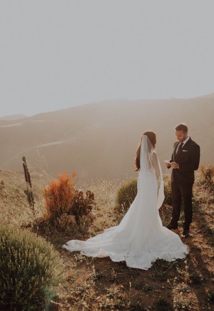 Photo of the couple in the mountains. Mobile image