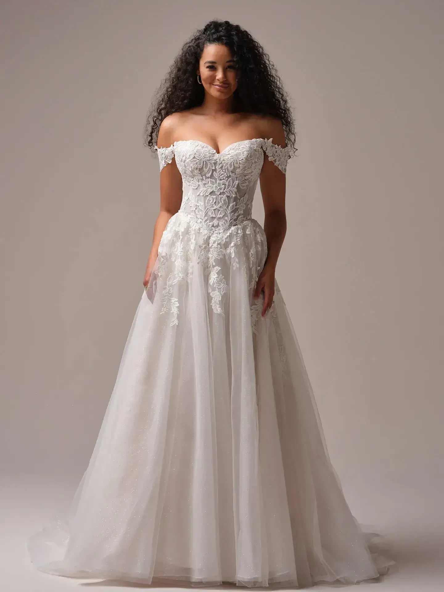  Model is wearing a strapless basque waist sequin A-line wedding dress with detachable off the shoulder straps