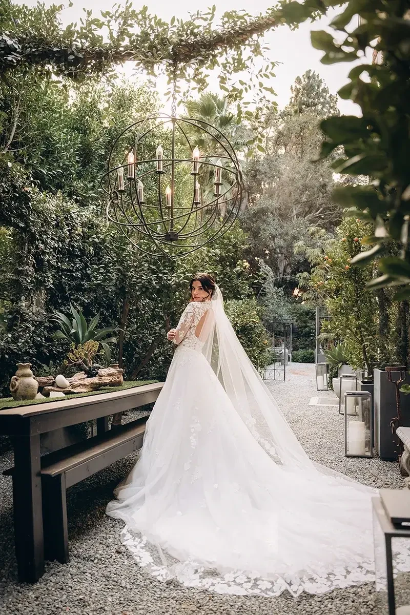 model is wearing a high neckline lace a-line wedding dress